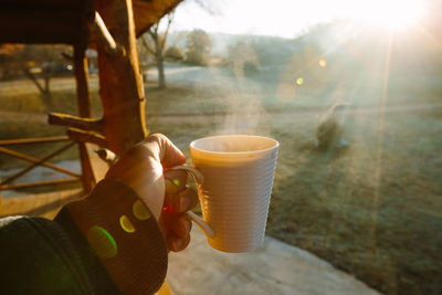 Man holding coffee cup