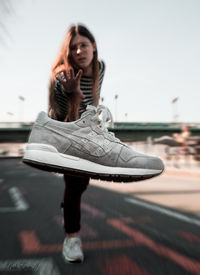Portrait of young woman sitting outdoors