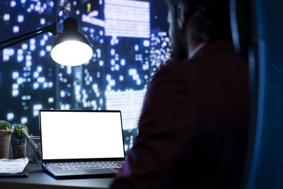 Midsection of businessman using digital tablet