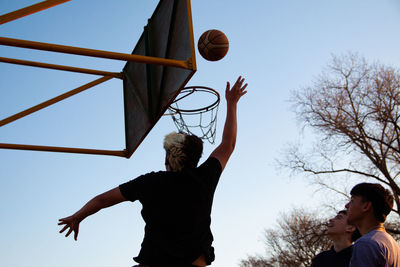 Portrait of street baskteball game