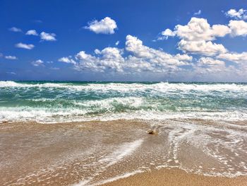 Scenic view of beach against sky