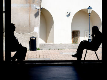 Man sitting in corridor