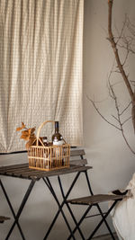 Close-up of wicker basket on table at home