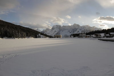 Scenic view of snow covered mountains against sky