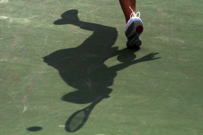 Low section of athlete on tennis court