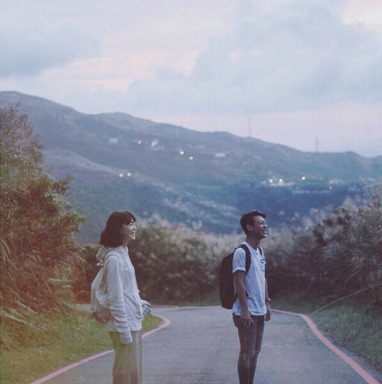 two people, mountain, togetherness, heterosexual couple, bonding, leisure activity, mountain range, cloud - sky, sky, outdoors, young adult, real people, women, nature, friendship, happiness, beauty in nature, water, landscape, young women, day, adults only, adult, people