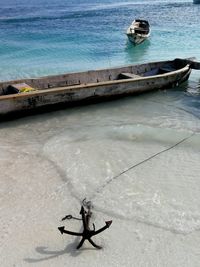 High angle view of nautical vessel on sea shore
