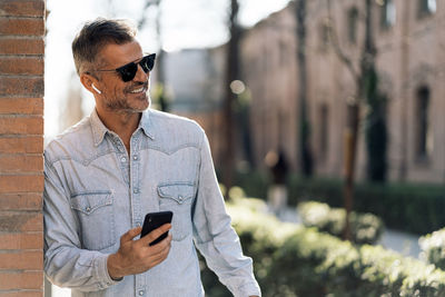 Man using mobile phone outdoors