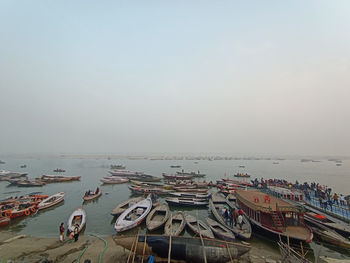 High angle view of boats moored on sea against sky