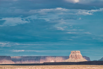 Scenic view of arid landscape against sky