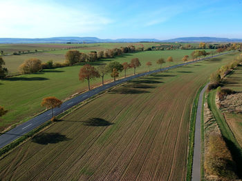 Scenic view of farm against sky