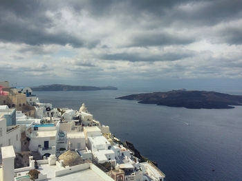 Town against cloudy sky