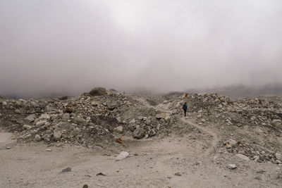 Scenic view of landscape against sky during foggy weather