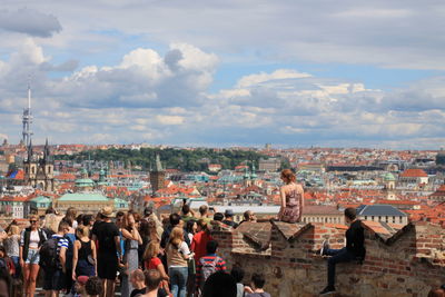 People in city against sky