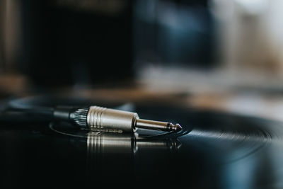 Close-up of machine part on table