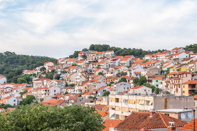 Houses in town against sky