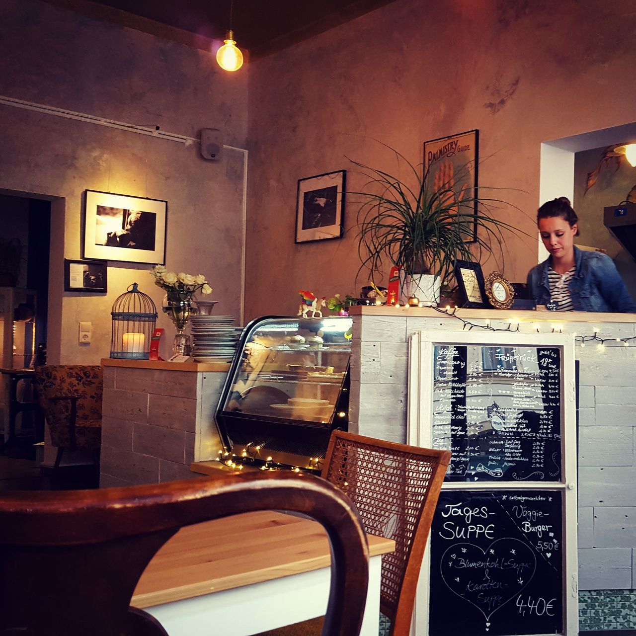 indoors, table, chair, home interior, illuminated, restaurant, sitting, technology, communication, house, domestic life, domestic room, picture frame, sofa, absence, window, lighting equipment, mirror