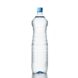 Close-up of glass bottle against white background