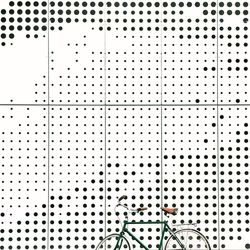 Bicycle parked against patterned wall