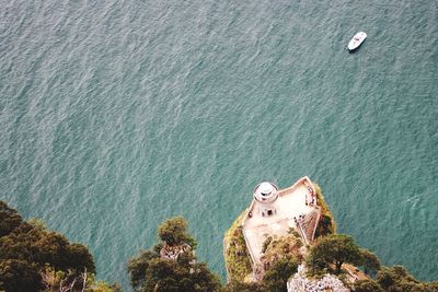 High angle view of lighthouse at coast