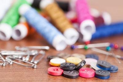 Close-up of colorful sewing items on table