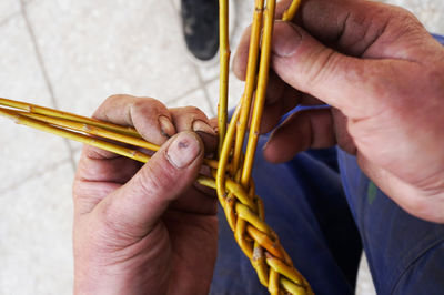 High angle view of people holding stem