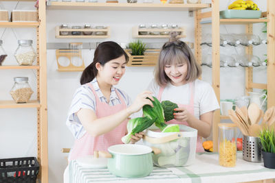 Young woman smiling while standing in store