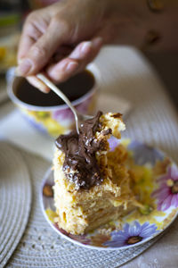 Close-up of hand holding ice cream