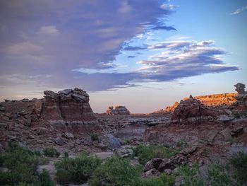 Rock formations on landscape against sky