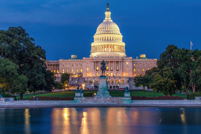 View of united states capitol, ulysses s. grant memorial and reflecting pool, washington dc, usa