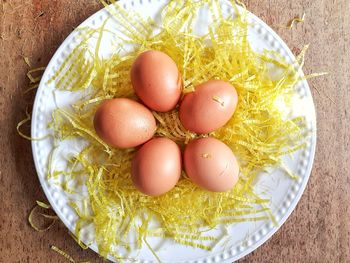 High angle view of eggs in plate on table