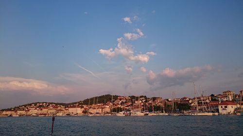 View of town against cloudy sky