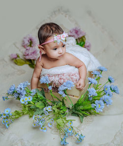 Portrait of young woman with bouquet