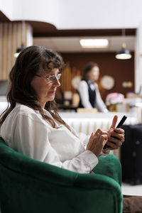 Young woman using mobile phone