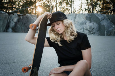 Portrait of a skater girl looking thoughtful at a skate park