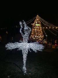 Close-up of illuminated christmas tree at night during winter