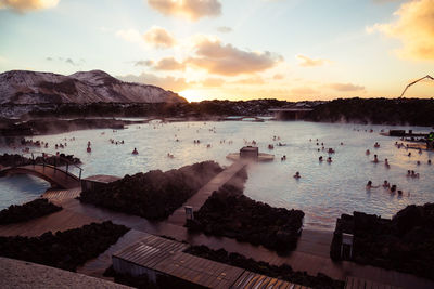 High angle view of people in river against sky