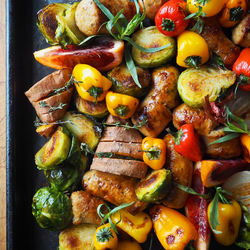 High angle view of fruits and vegetables on barbecue