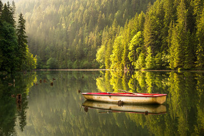 Boat floating on water in lake