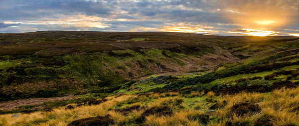 Scenic view of landscape against sky during sunset