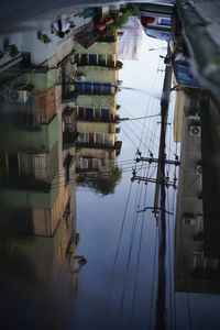 Reflection of buildings in puddle
