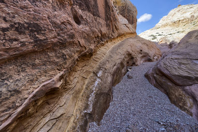 Low angle view of rock formation against sky