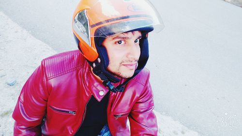 High angle portrait of man wearing crash helmet