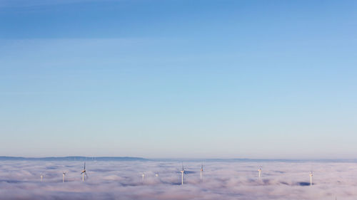 Scenic view of snowy landscape against clear blue sky