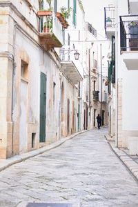 Narrow street amidst buildings in town