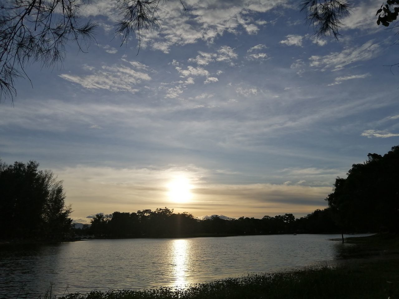 water, sky, tree, reflection, nature, cloud, beauty in nature, plant, tranquility, scenics - nature, morning, lake, tranquil scene, dusk, sunlight, no people, silhouette, environment, idyllic, outdoors, sun, non-urban scene, landscape, sunrise, land, body of water, beach, travel destinations