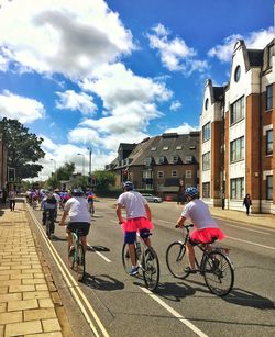 People on road against buildings