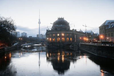 Reflection of illuminated buildings in water