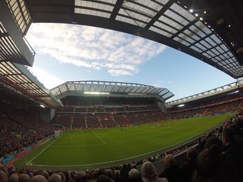 Low angle view of soccer field against sky