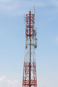 Low angle view of communications tower against sky